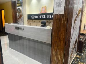 a hotel room with a reception counter in a store at Hotel Royal Palace in Kolkata