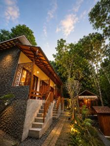 a house with stairs leading up to it at Tegal Luwih Cabin in Munduk