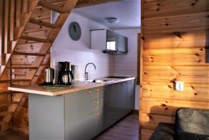 a kitchen with a sink and a counter top at Alevi Camping in Stöllet +41 photos