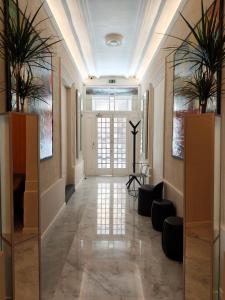 a hallway with a large mirror in a building at Ursulino Valletta in Valletta