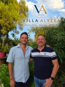 two men are standing next to each other at Villa Alyzea Chambre d'hôtes réservée aux adultes in Bessan