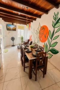 a dining room with a table and chairs at Residência Ilha Bela - Casa Inteira no Centro Histórico de São Luís in São Luís