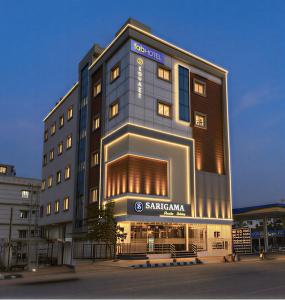 a building with a sign on the front of it at Hotel Skyland Khammam in Khammam