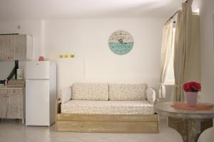 a living room with a couch and a refrigerator at Appartamento Mura in Forio d'Ischia