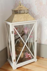 a small white cabinet with aoirituresitures at Cozy Flat Porto Downtown in Porto