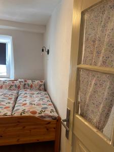 a bedroom with a bed next to a window at Ferienhaus Vinzenze in Ediger-Eller +7 photos