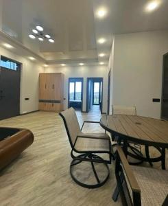 an empty room with a table and chairs in it at Millenium Villa in Kʼanakʼerravan