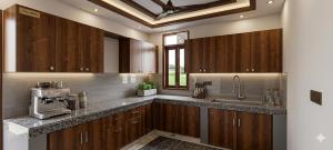 a kitchen with wooden cabinets and a sink at Hotel Aroha Stayz At Sector 44 Noida in Noida