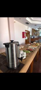 a long table with many plates of food on it at Blue Waves Hotel & Suites in Sarandë