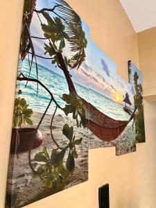 a picture of a hammock on the beach at Piink Lopez in Manzini