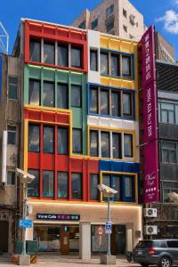 a multicolored building on the side of a street at V-one Hotel - Ningxia No. 2 Inn in Taipei