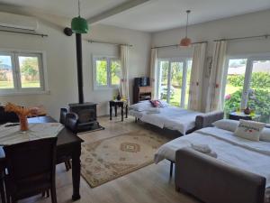 a living room with two beds and a fireplace at Villa Piano in Gebze +125 photos