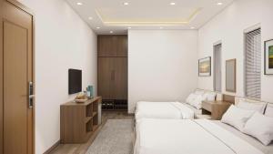 a hotel room with two beds and a tv at Eco House Cat Ba in Hai Phong
