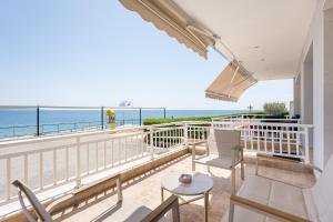 a balcony with a view of the ocean at Theatre Home Aegean View in Nea Moudania