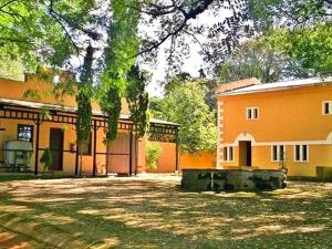 a building with a large yard in front of it at Blue Mountain Estate in Hazyview +6 photos
