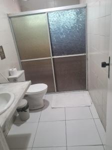 a bathroom with a shower with a toilet and a sink at Hostel Way Fortaleza in Fortaleza +59 photos