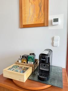 a coffee maker on top of a table at BeWell Apartment in Zalakaros