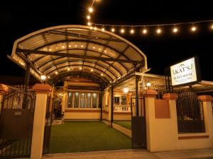 an entrance to a building at night with lights at Kat's GuestHouse in Hua Hin
