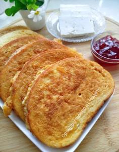 two pancakes sitting on a plate on a table at Семеен хотел Кристал in Smolyan