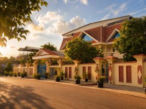 a house on the side of a street at Abode Hotel Siem Reap in Phum Pobos