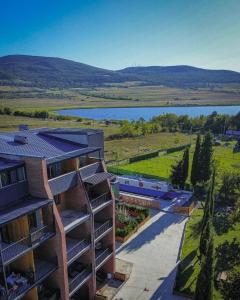 an aerial view of a building with a view of a lake at Bazaleti Lake Escape in Bazalet'i
