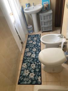 a bathroom with a toilet and a sink at Residence Della Corte in Tocco da Casauria +44 photos