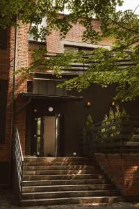 a building with stairs in front of a building at Apartament w Parku 5 in Żywiec +7 photos