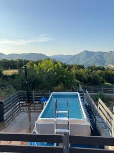 a swimming pool on the deck of a house at Elatovillage in Elatochori