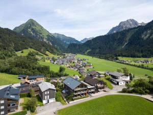 an aerial view of a village in the mountains at n Apartments Hotel in Schoppernau