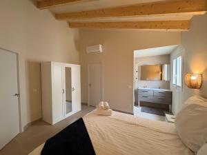 a bedroom with a large bed and a bathroom at Casa de Limon in Palma de Mallorca