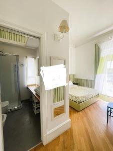 a bathroom with a sink and a bed in a room at B&B Cèsar in Castrignano del Capo +80 photos