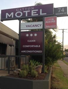 a sign that is on the side of a building at Gatton Motel in Gatton