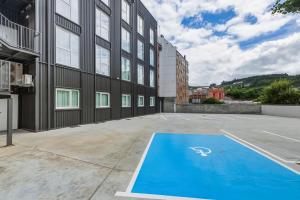an empty parking lot in front of a building at B&B HOTEL A Coruña Aeropuerto in Culleredo