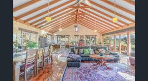 a living room with a couch and a table at Mountain View Farm in Portland