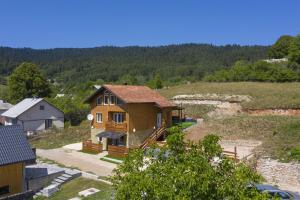 a small house on top of a hill at Villa Velebita House for 9 near Plitvice Lakes in Rudopolje