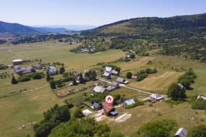an aerial view of a small village on a hill at Villa Velebita House for 9 near Plitvice Lakes in Rudopolje