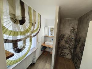 a bathroom with a sink and a mirror at Kurhotel Wiedenmann in Bad Wörishofen