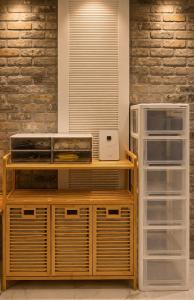 a kitchen with a toaster oven and a refrigerator at Stay PAUSE in Bucheon