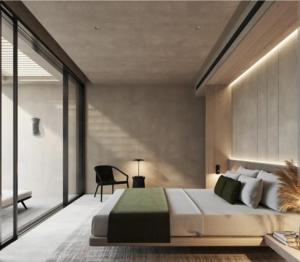 a bedroom with a large bed and a chair at The corbett story in Rāmnagar +17 photos
