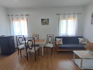 a living room with a couch and a table at O LAR DO SIL - Ribeira Sacra in Villar de Cerreda