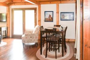 a dining room with a table and chairs at The Lake House A Hidden Gem Sleeps 4 in Columbia