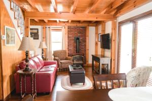 a living room with a couch and a stove at The Lake House A Hidden Gem Sleeps 4 in Columbia