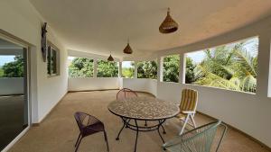 a dining room with a table and chairs at Villa La Pommone in Somone