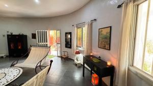 a living room with a couch and a table at Villa La Pommone in Somone