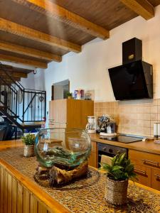 a kitchen with a large glass bowl on a counter at Villa Rustica in Pokrovnik