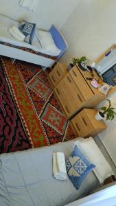 an overhead view of a bedroom with a bed and pillows at Akmuz House in Ak-Muz