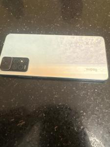 a cell phone sitting on top of a table at Manwel el ga7d in Giza