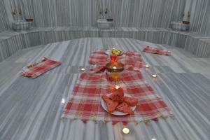 a table with a plate of food on it at Grand Beyaz Saray Otel in Duzce