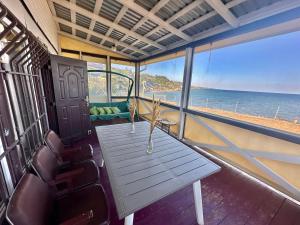 a table on a boat with a view of the ocean at домик у самого моря in Odesa