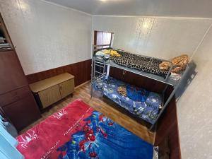an overhead view of a room with two bunk beds at домик у самого моря in Odesa